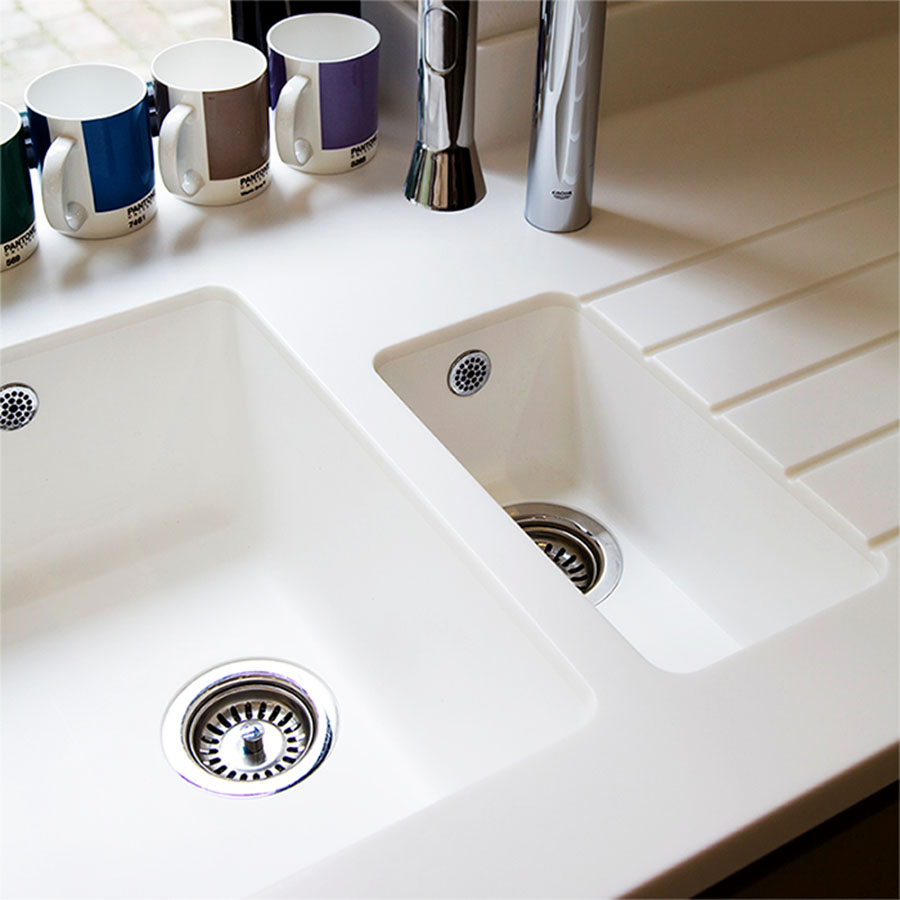 Undermount and integrated bowls for solid surface