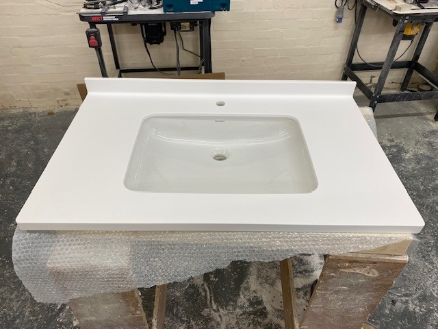Seamless solid surface bathroom worktop installation in Leicester - project photo 18