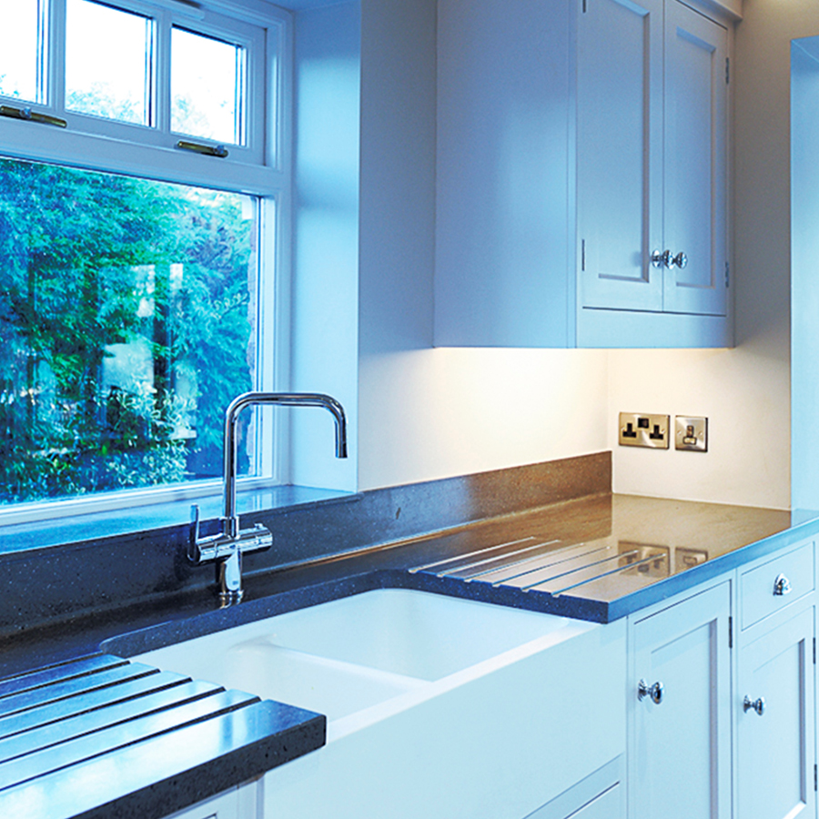 Solid surface upstand detail along a wall